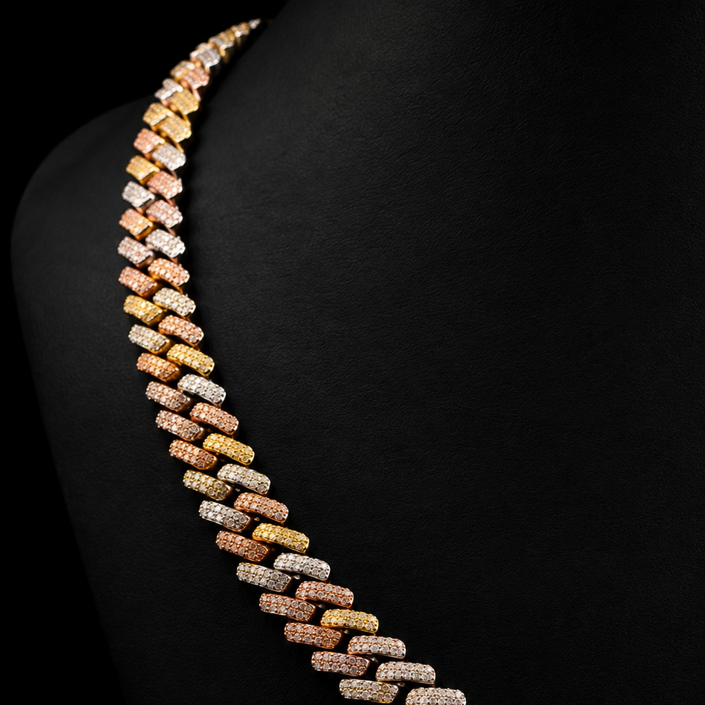  The necklace features alternating rows of small rectangular links in yellow gold, rose gold, and white gold, each heavily set with clear pavé gemstones.